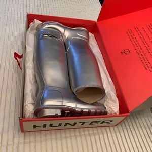 Never been worn, in the box.  Silver Hunter boots